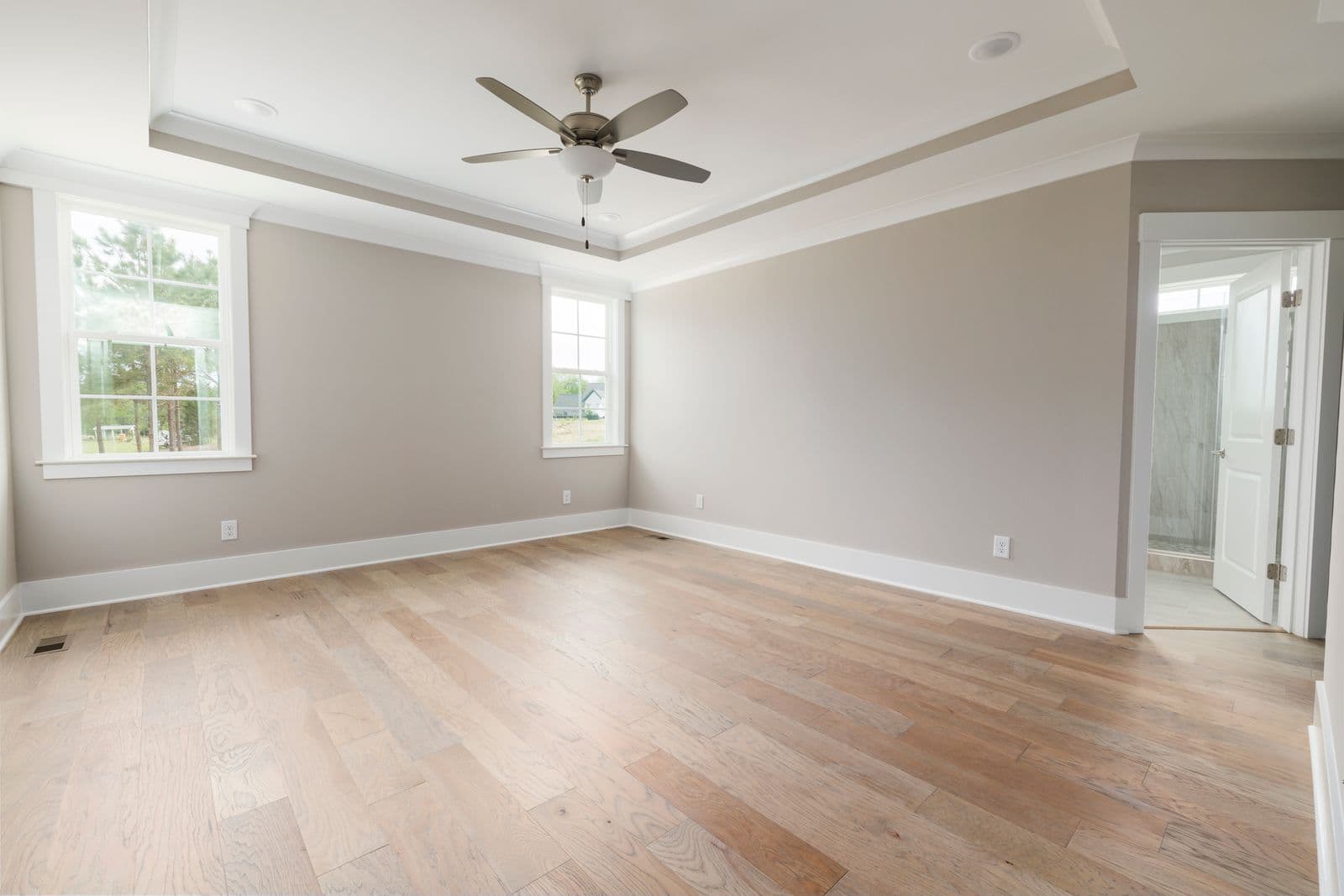 Ceiling fan installed in a bright room